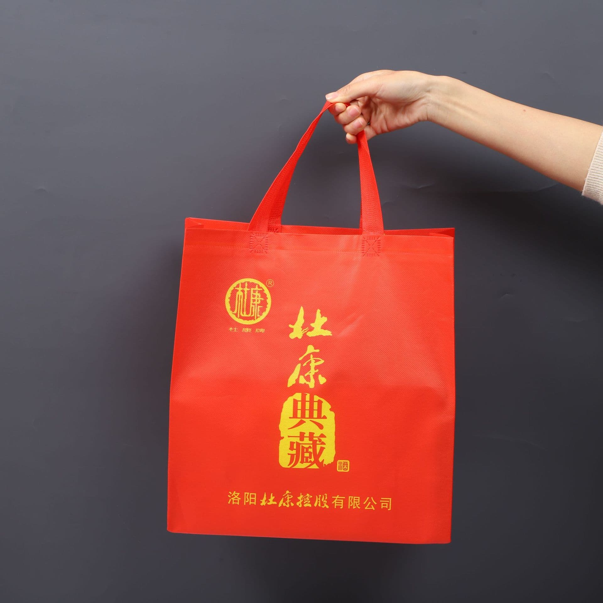 Custom order wine carry bags, laminated non-woven liquor gift bags, festive red printed bags