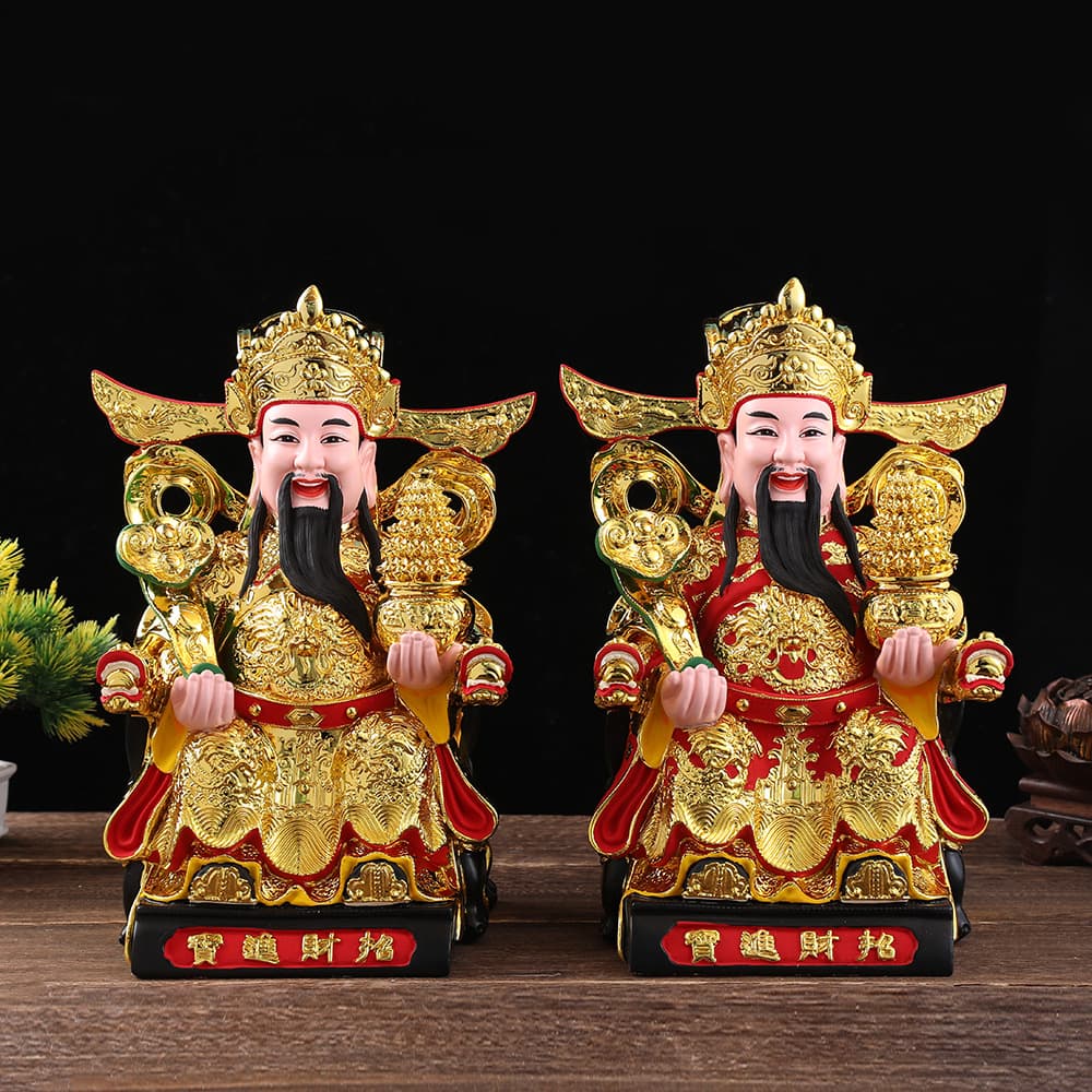 A resin Buddha statue of the God of Wealth holding a gold ingot, suitable for home worship, auspiciousness, business opening, and as a decorative item.
