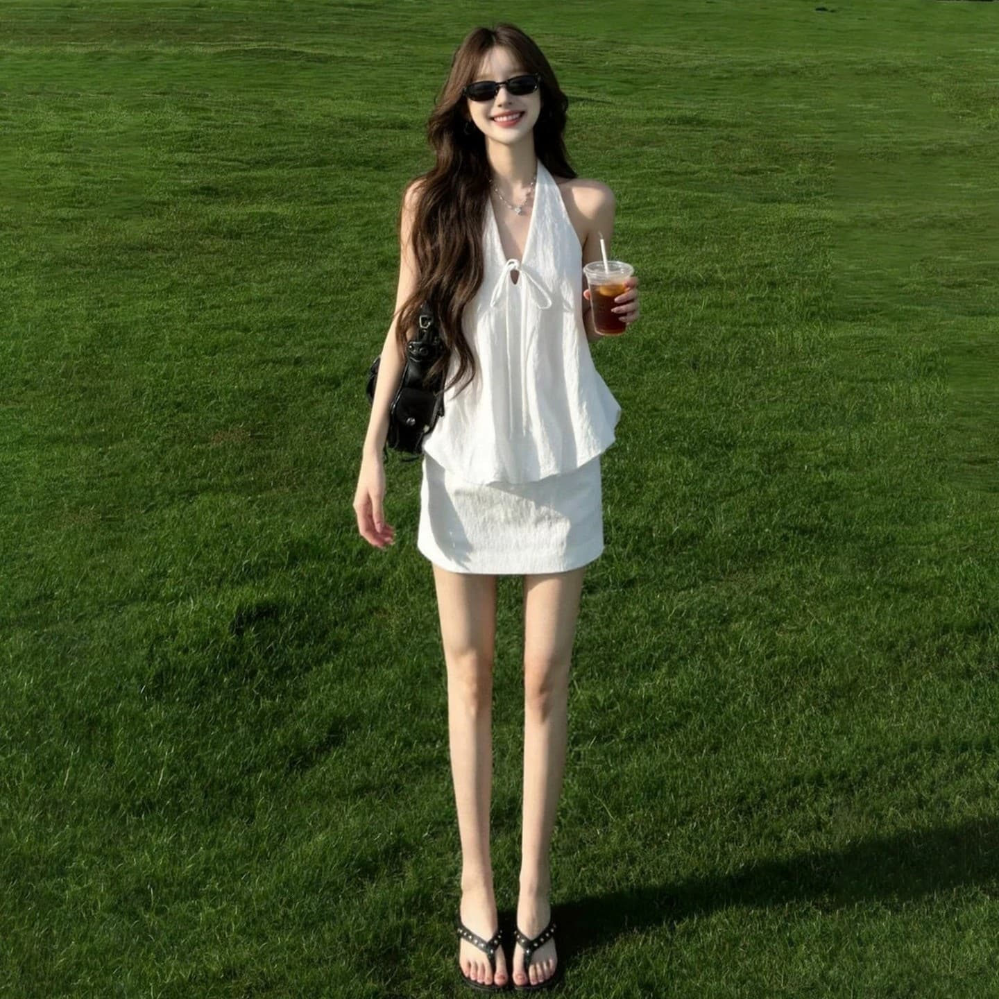 White V-neck halter suit for women 2026 summer new style lace-up vest, hip-covering short skirt, pure lust temperament two-piece set