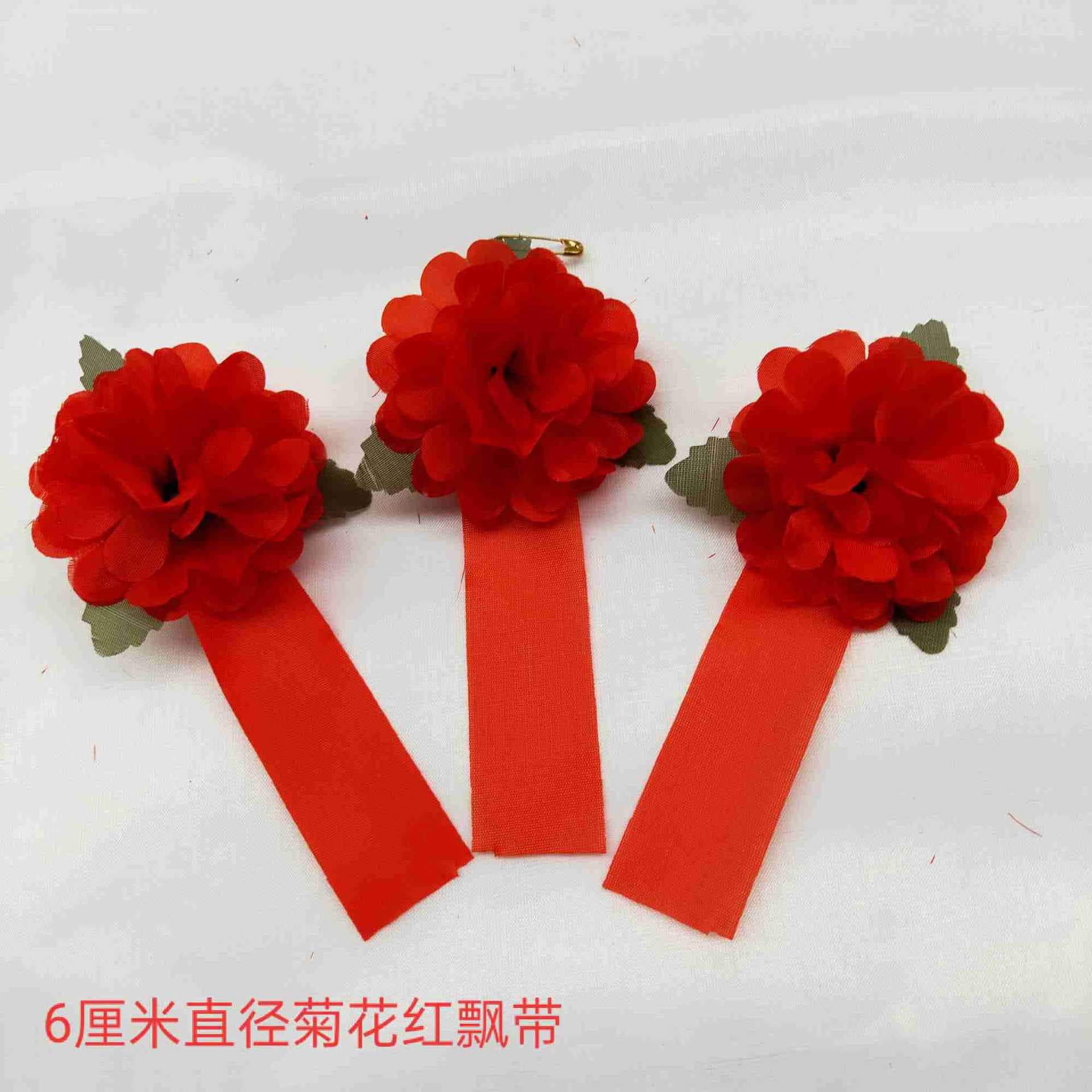 Funeral supplies: medium-sized red corsages for memorial services and white affairs.