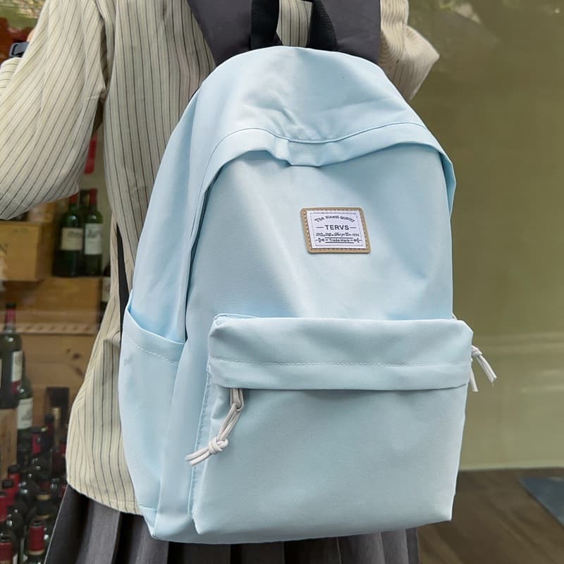 Large capacity solid color schoolbag female junior high school student Korean style simple backpack female Japanese high school 15.6 inch backpack