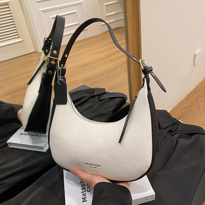 High-end baguette underarm women's bag niche design 2024 new crescent saddle bag soft leather hand carry shoulder women's bag