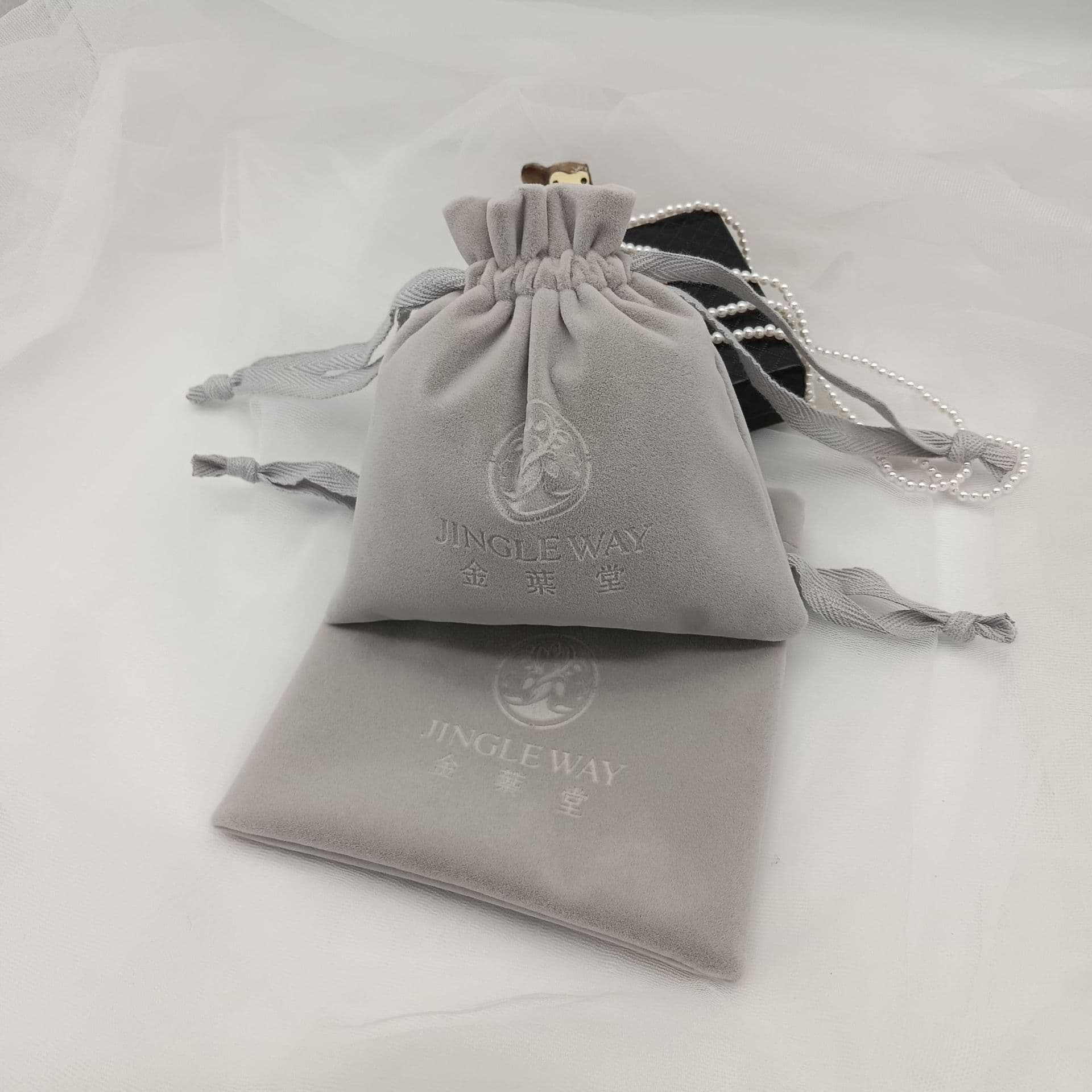 High quality gray plush storage drawstring bag eyes charging treasure dustproof flannel bundle pocket headphones U disk packaging